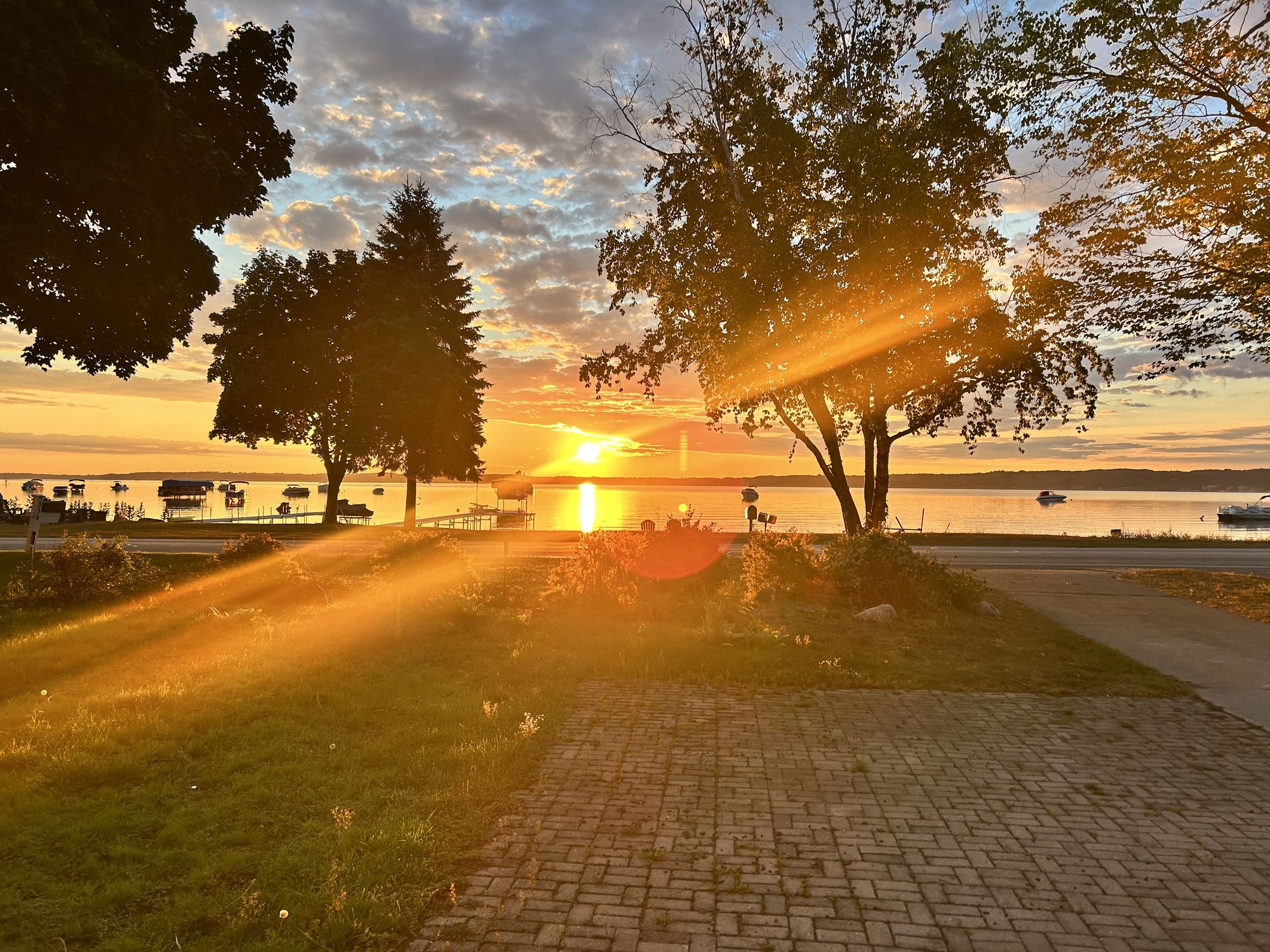 Sunrise reflected in a puddle outside the lake villa