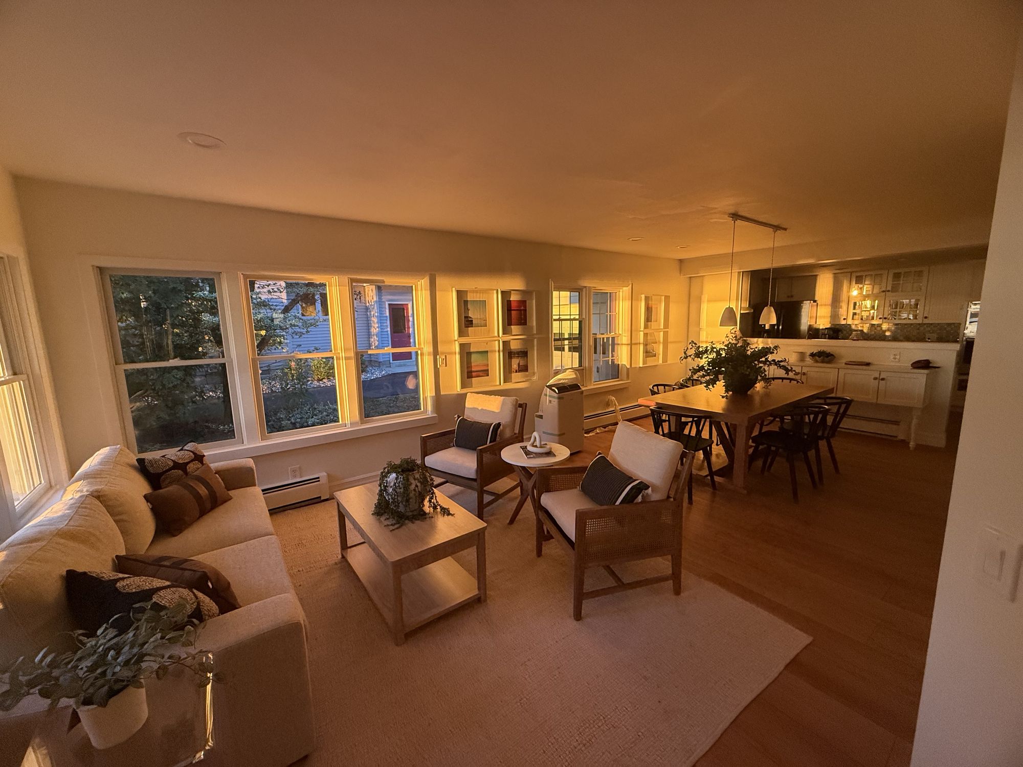 Sunrise light across the open living and dining area